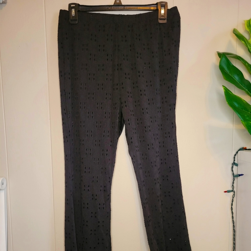 Black flare pants with cutout pattern
